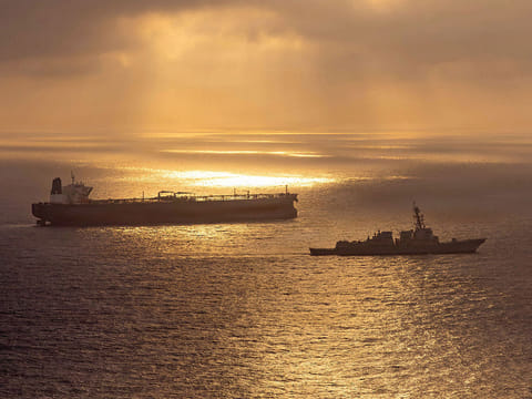 Arleigh Burke-class guided-missile destroyer USS Rafael Peralta (DDG 115) implementing a maritime blockade against the Iran-flagged crude oil tanker vessel Herby