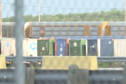 In this image taken from video footage provided by KGNS, Union Pacific train cars are stationed at a rail yard in Laredo, Texas, Sunday, May 10, 2026. (KGNS via AP)