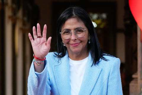 FILE - Venezuela's acting President Delcy Rodriguez waves after bidding farewell to U.S. Energy Secretary Chris Wright following their meeting at Miraflores Palace in Caracas, Venezuela. File photo taken on Feb. 11, 2026.