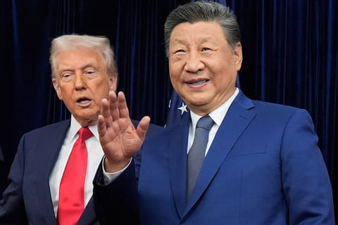 Chinese President Xi Jinping, right, waves, with President Donald Trump, ahead of their summit talk at Gimhae International Airport in Busan, South Korea. File photo taken on Oct. 30, 2025.