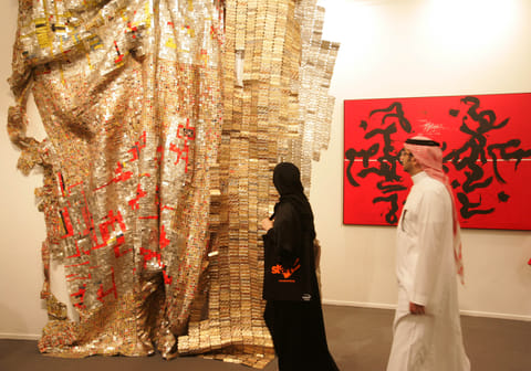 Visitors check out art displayed at Art Dubai in 2011, which has become a leading contemporary art fair for collectors artist and professionals from the Middle East,