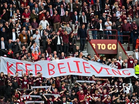 Hearts fans react after the final whistle in the Scottish Premiership football match between Hearts and Rangers at Tynecastle Stadium