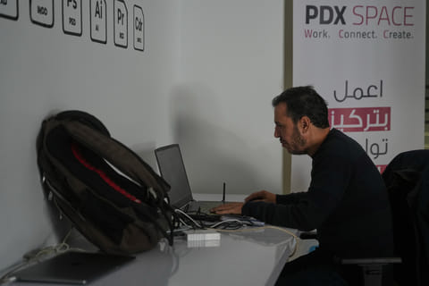 Palestinian programmer Tarik Zaeem, 44, works on his computer at a coworking space in Gaza City, March 8, 2026. (AP Photo/Abdel Kareem Hana)