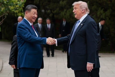 US President Donald Trump (R) shakes hands with China’s President Xi Jinping as he leaves after a visit to Zhongnanhai Garden in Beijing on May 15, 2026.