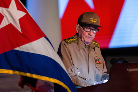 FILE - Former Cuban President Raul Castro looks at the Cuban flag during his speech at the event celebrating the 65th anniversary of the triumph of the revolution in Santiago, Cuba, Jan. 1, 2024. (AP Photo/Ismael Francisco, File)
