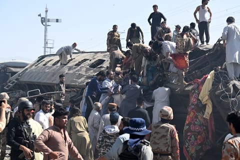 Security personnel and residents rescue injured blast victims from derailed carriages after an explosion targeted a train in Quetta on May 24, 2026.