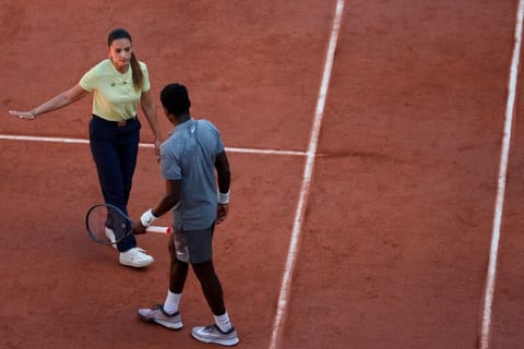 Brazilian chair umpire Ana Carvalho speaks to France's Moise Kouame as he plays against Paraguay's Adolfo Daniel Vallejo during their men's singles match on day 5 of the French Open tennis tournament on Court Suzanne-Lenglen at the Roland-Garros Complex in Paris on May 28, 2026.