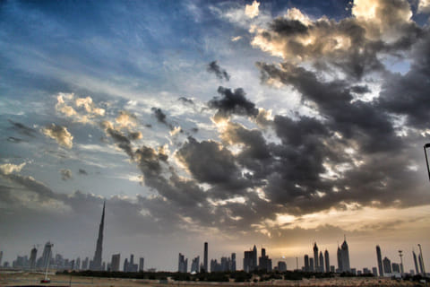 Skyline of Dubai under the beautiful cloudy sky.