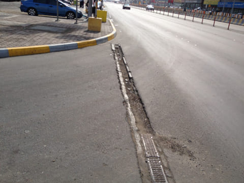 Damaged roads and exposed metal pose danger to vehicles