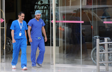 Saudi medical staff leave the emergency department at a hospital in Riyadh. Saudi nationals set to benefit as healthcare localisation targets rise