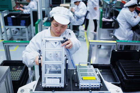 Worker at small parts manufacturing factory in China. While supply chain disruptions are hurting the global economy, analysts say markets recovery depends on the speed with which China’s capacity utilization bounces back to the normal level.