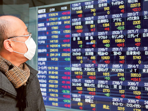 File: An electronic stock indicator in Tokyo. On April 14, 2020, Tokyo's benchmark Nikkei index jumped more than 3.1 percent to a one-month high on Tuesday as hopes for US measures to jump-start its virus-hit economy encouraged investors.