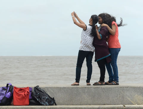Youngsters take ‘selfies’ along the Marine Drive promenade in Mumbai, which police have identified as one of the dangerous selfie spots in the city.