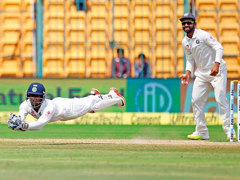 Wriddhiman Saha dives to complete a spectacular catch to dismiss Australia’s Matthew Wade during India's home Test series in 2018.