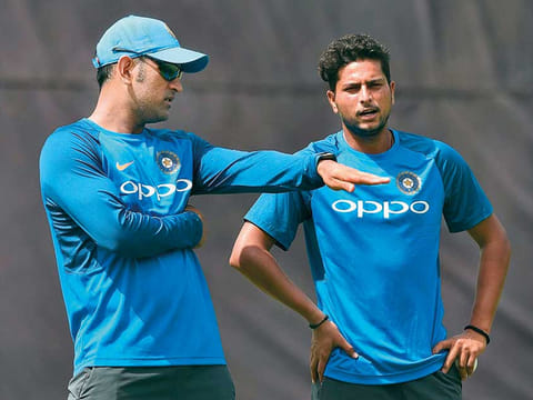 Mahendra Singh Dhoni (left) had always been a great source of cricketing intelligence and inputs for spinners like Kuldeep Yadav, according to Kiran More.