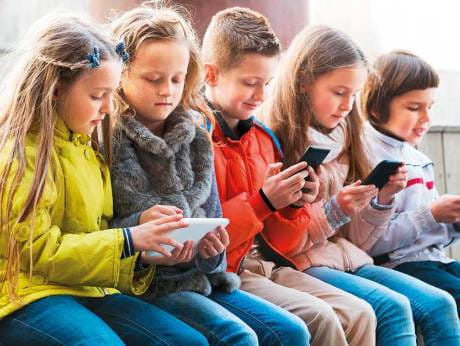 Children texting. Picture for illustrative purposes only