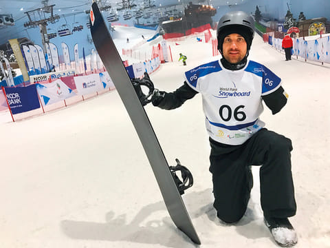 Sean Pollard celebrates after winning the gold in the first World Para Snowboard World Cup at Ski Dubai on Wednesday.