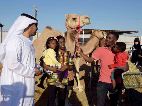 Tourists at the Camel Farm in Al Ain.
