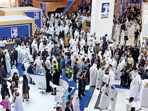Delegates and visitors tour the Adnoc pavilion during the last day of Adipec on Thursday.
