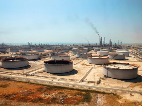 Oil soared above $100 and stocks sank Thursday as Iran's fresh attempts to hit supplies in the Middle East and threats to bring down the global economy overshadowed a record release of strategic crude by the International Energy Agency.