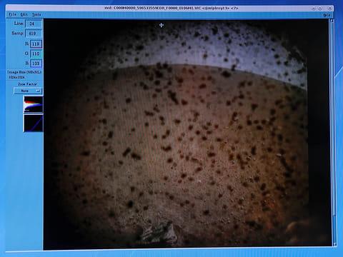 The first picture sent back to NASA's Jet Propulsion Laboratory (JPL) from the spaceship InSight is shown on a video screen at JPL in Pasadena, California, U.S. November 26, 2018.