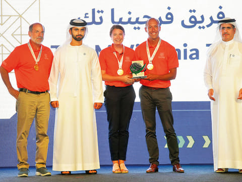 Shaikh Mansour with Team FutureHAUS by Virginia Tech, US, at the Solar Decathlon Middle East Awards Ceremony.