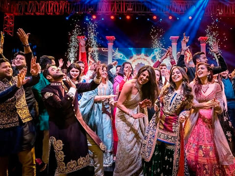 Bollywood actress Priyanka Chopra, center right dances with guests during a ceremony before her wedding with Nick Jonas , at Umaid Bhawan in Jodhpur, India.