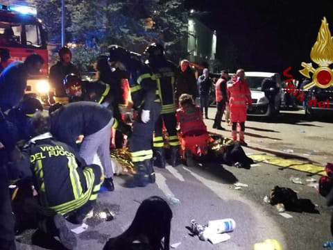 Emergency personnel attend to victims of a stampede at a nightclub in Corinaldo, near Ancona, Italy, in this undated handout picture obtained by Reuters December 8, 2018.