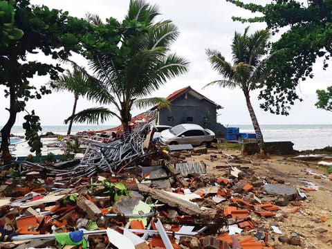 A car lies among ruins after a tsunami hit Carita beach in Pandeglang, Banten province, Indonesia.