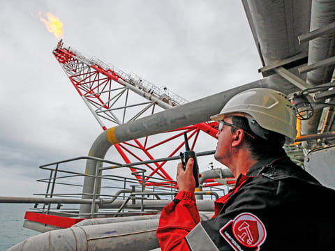 An oil platform operated by Lukoil in the Caspian Sea, Russia. Russia is cutting output as part of the Opec+ deal.