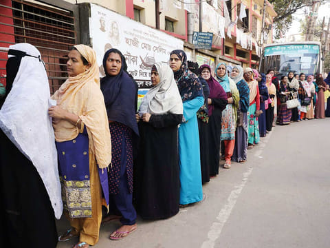 Female voters stand in a queue of a voting center to cast their vote during the general election in Dhaka, Bangladesh, December 30, 2018.