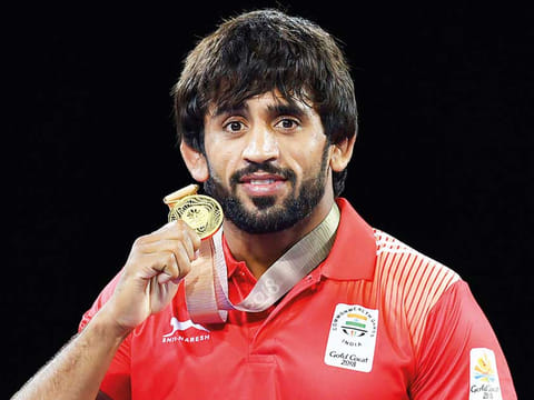 India's freestyle wrestler Bajrang Punia hopes to be posing with more medals at the Tokyo Olympics.