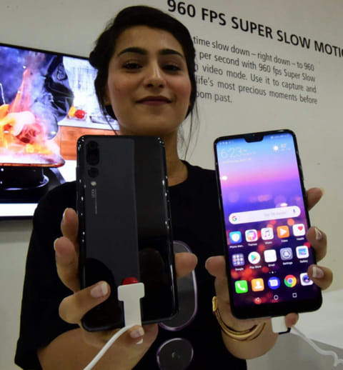 Huawei launches two flagships to take on Apple and Samsung
