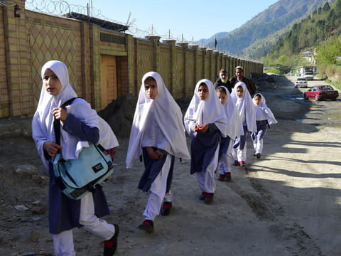 Pakistani students arrive at the Khpal Kor Model School, which was built with Malala Yousafzai's Nobel prize money, in Malala's home district of Shangla in Pakistan's Swat region, on March 30, 2018. Pakistan is planning a phased reopening of its educational institutions from September 15.