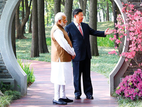 Modi and Xi Jinping take a walk in a garden in Wuhan in central China’s Hubei Province (File)