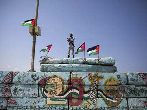 A Palestinian police officer stands guard at the Gaza seaport, in Gaza City (File)