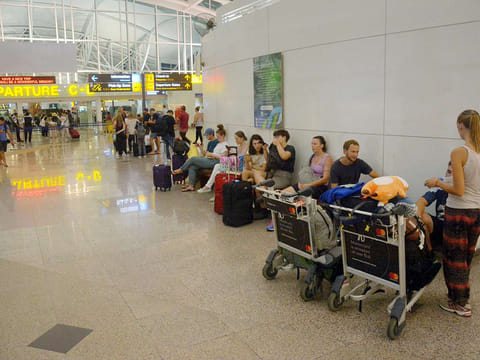 Passengers at the International Terminal at Ngurah Rai Airport. The release of the Australians followed weeks of speculation that a deal for their return was in the works.