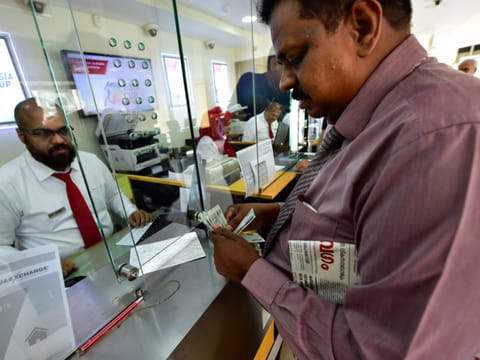 File picture from a time when UAE Exchange House was taking in remittances. Now, its operations have been placed on hold and is under investigation by UAE Central Bank.