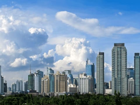 The skyline of Makati, the financial district of Manila in the Philippines. Business and consumer confidence are also cautiously positive given wider availability of vaccines and relaxation of lockdowns, quarantine measures, and mobility restrictions.