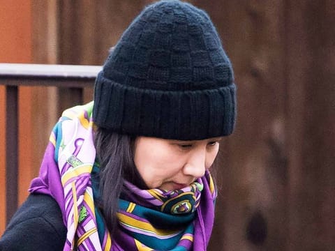 In this Wednesday, Dec. 12, 2018 file photo, Huawei chief financial officer Meng Wanzhou leaves her home in Vancouver, British Columbia.