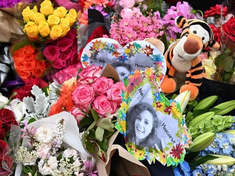 flowers during a vigil in memory of murdered Aiia Maasarwe in Melbourne on January 18, 2019. Hundreds of Australians dressed in black gathered in Melbourne on the steps of Victorian state parliament on January 18 for a silent vigil in memory of murdered Aiia Maasarwe.