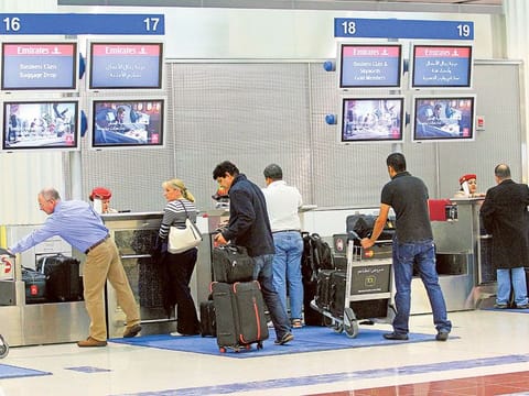 Passengers at the Emirates check-in counter.
