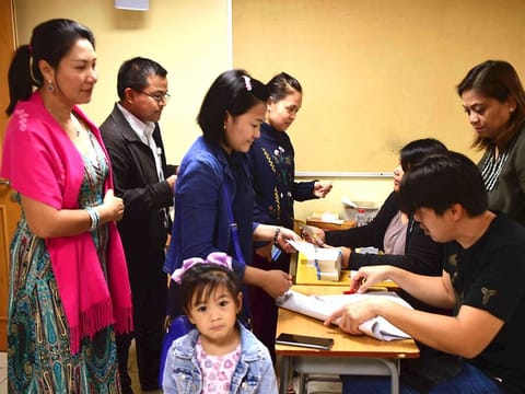 People getting Papal Mass tickets at St Francis Catholic Church, Jebel Ali