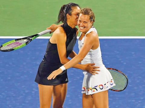 Su-wei Hsieh and Barbora Strycova celebrate after winning the women’s doubles crown in Dubai on Saturday.