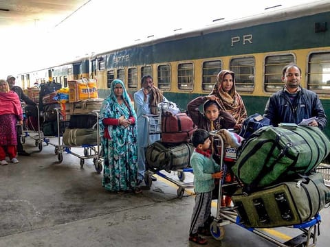 Passengers, arriving from Pakistan by Samjhauta Express train, wait for custom-check at Attari railway station, near Amritsar, Monday, Feb 25, 2019.