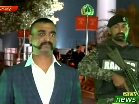 Indian pilot, Wing Commander Abhinandan, stands under armed escort near Pakistan-India border in Wagah, Pakistan in this March 1, 2019 image from a video footage.