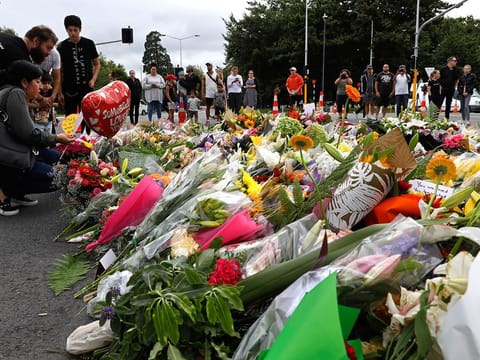 Mourners pay their respects at a makeshift memorial near the Masjid Al Noor mosque in Christchurch, New Zealan