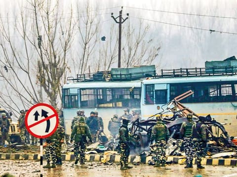 Security personnel carry out the rescue and relief works at the site of suicide bomb attack at Lathepora Awantipora in Pulwama district of south Kashmir