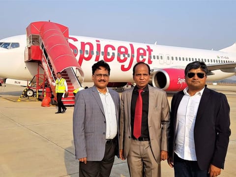 Indian expats Manas Panda, director of an electrical company, and Priydarshee Panigrahi, general manager of a consumer goods company, flank S.K. Chauhan, director of Jharsuguda Airport on the day of the Delhi-Jharsuguda inaugural flight.