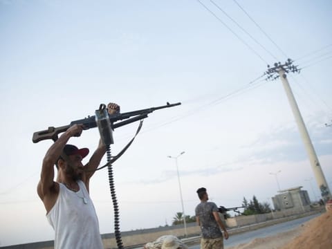 This file photo shows fighters under the Tripoli government on the front lines during clashes in southern Tripoli.